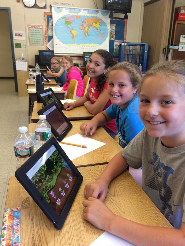 Students playing Prodigy on tablets
